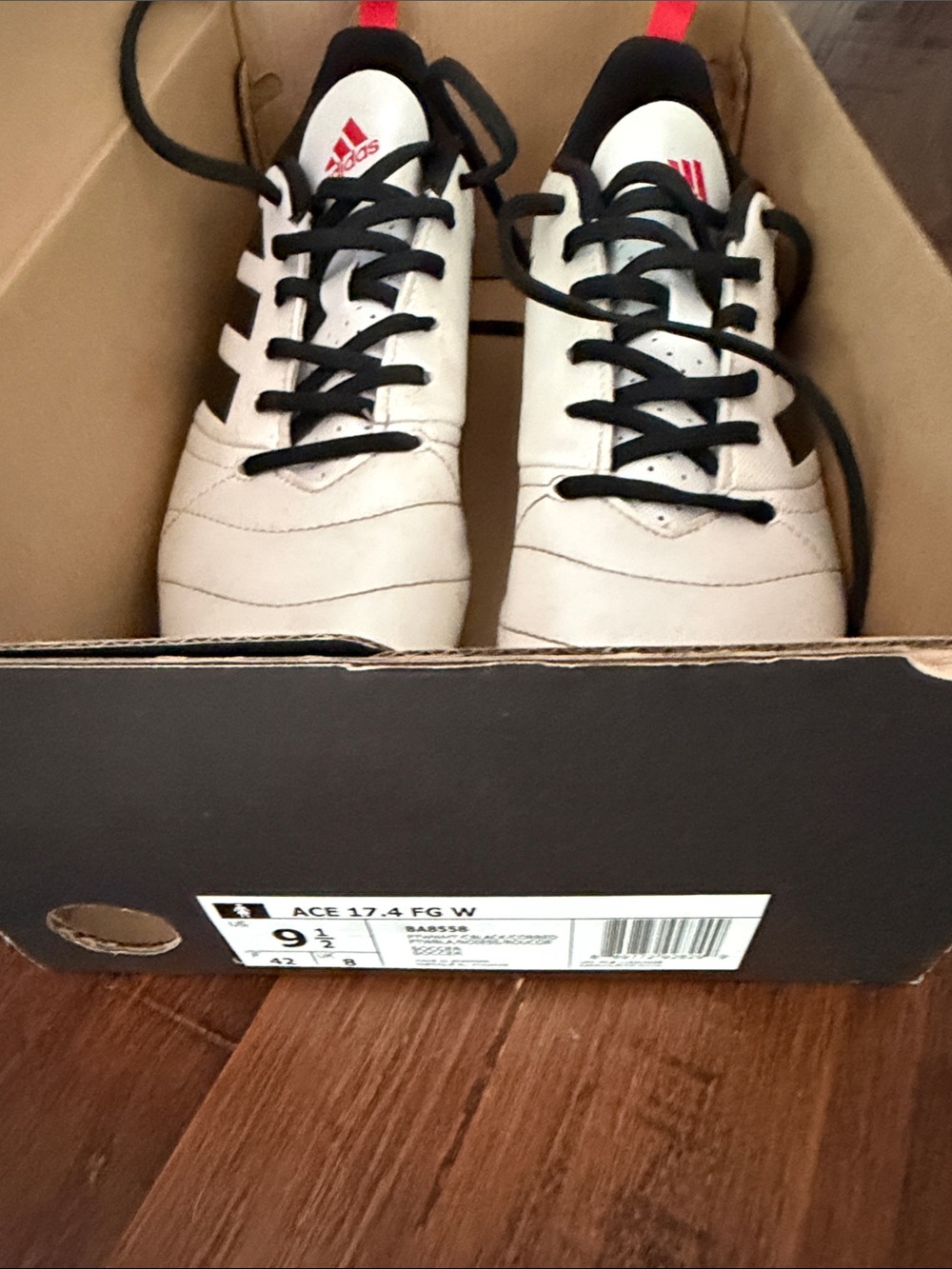 adidas Woman’s White and Black Soccer Shoes with Red Logo